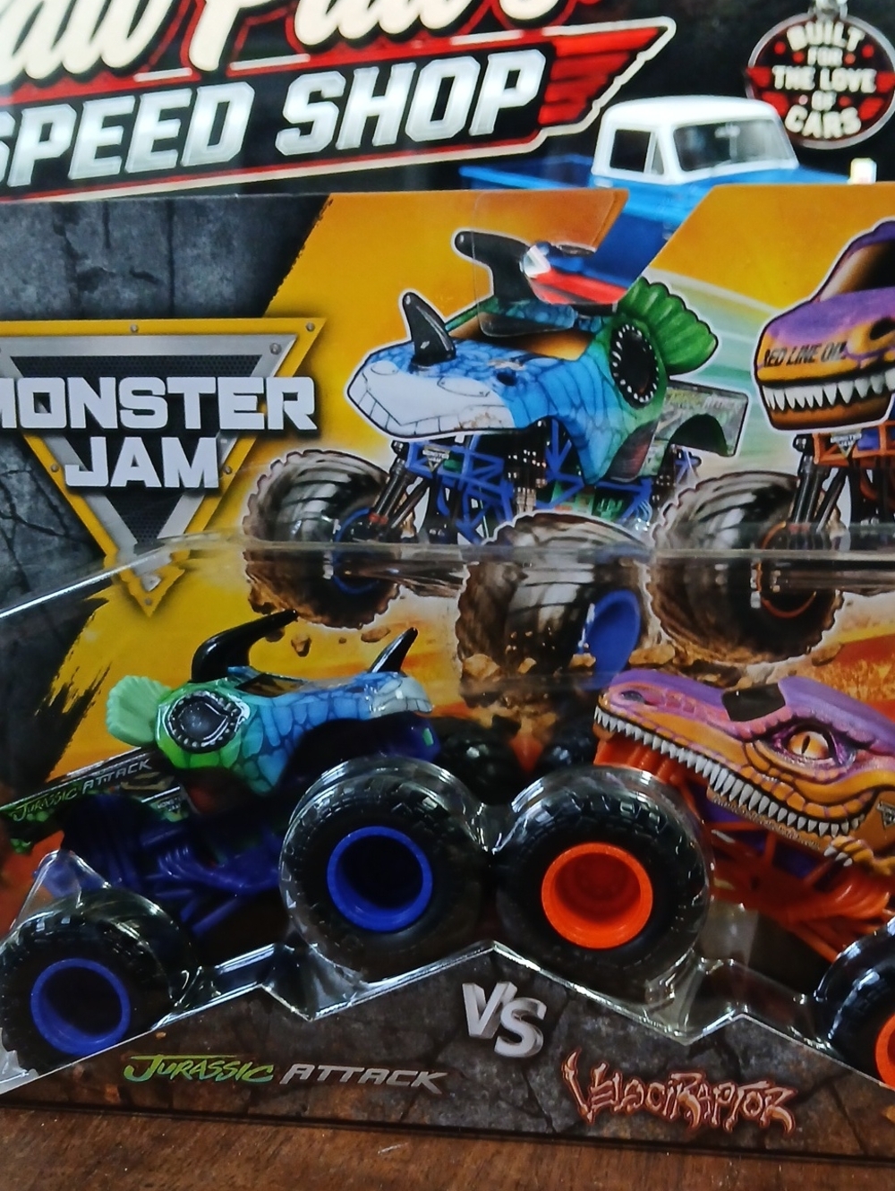 Jurassic Attack & Velociraptor Monster Trucks - Blue/Green & Orange/Purple